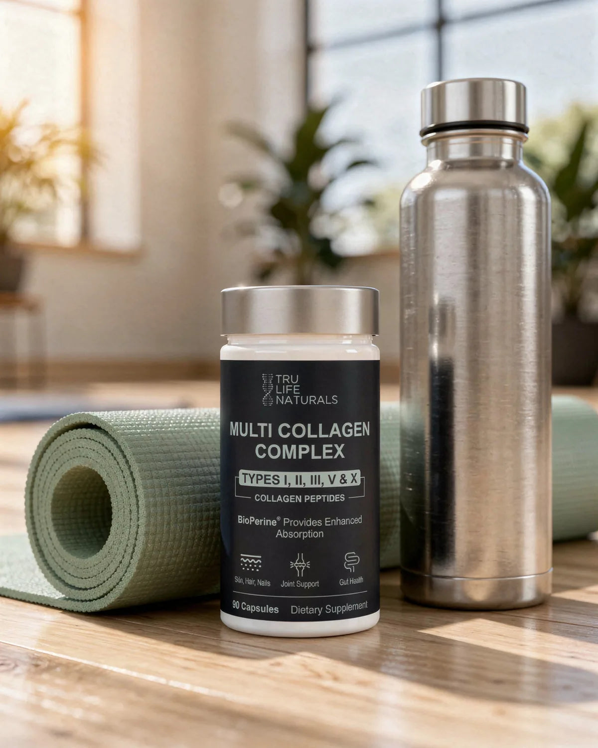 Multi-Collagen Complex bottle on a studio floor next to a yoga mat and a water bottle